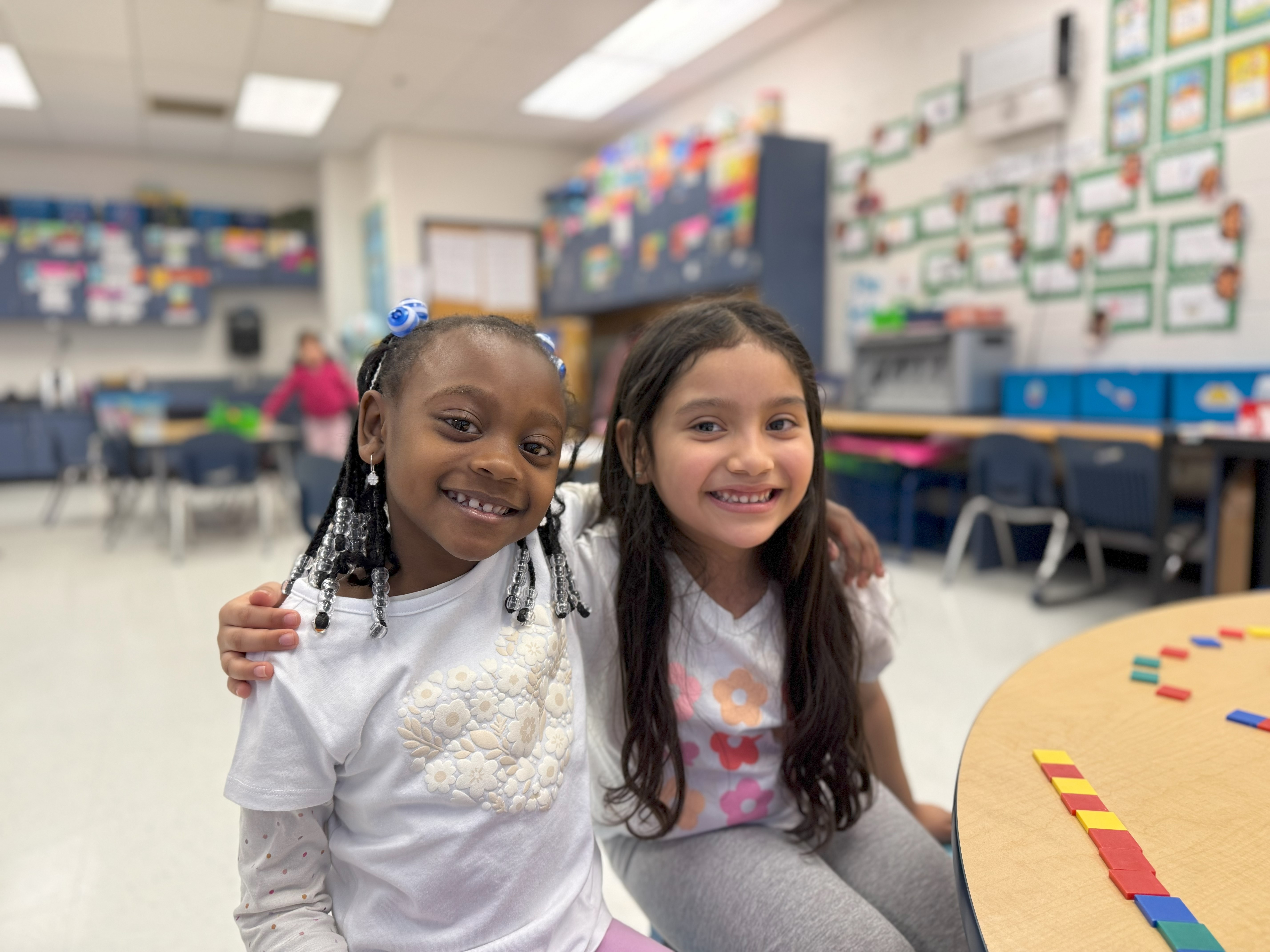 kindergarteners smiling at the camera